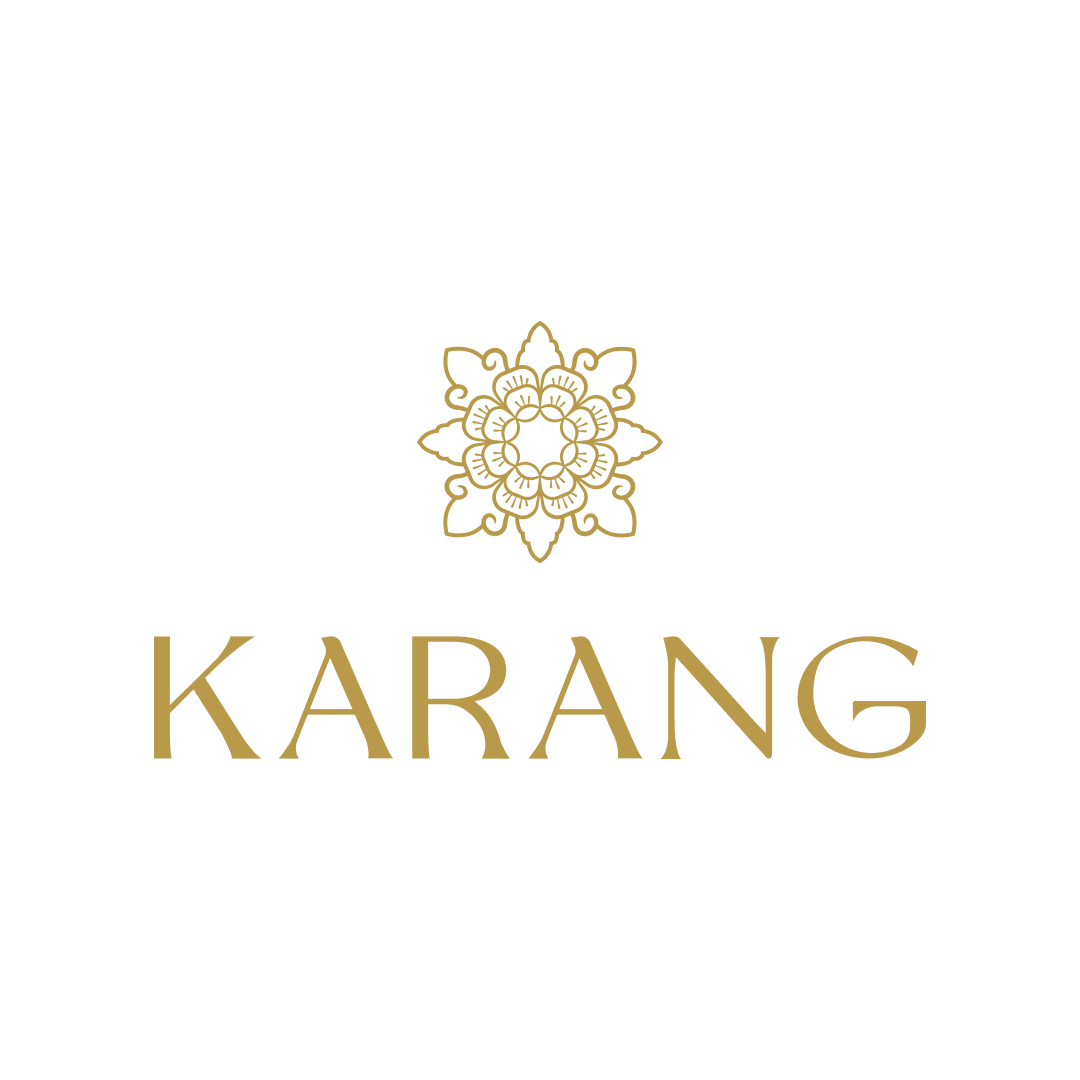 KARANG logo in gold with a floral emblem on a white background